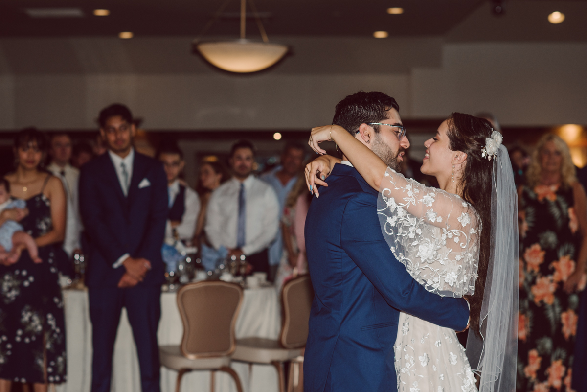 These two dancers, passionate lovers got married on a hot humid day at Auletto Caterers in Deptford NJ. Even though it was hot & humid Nina and Hector were all smiles as well as their family during the family portrait time. Wedding couple's and families that listens to you and does everything you ask them to even though the weather and environment can be tough are the BEST kind of clients! Nina and Hector were that best ideal clients, they from day one left all control regarding photo to me, did not question or have concerns. Knowing that you have this full trust and control on the wedding day makes you want to give your 100% and more. Nina and Hector are one of my top ideal clients and their wedding day photos are living proof of it. Nina and Hector's wedding day was combined of casual, mess, chaos, laughters, chill, emotional and passionate love for dancing. This was my first time at Auletto Caterers and in this part of NJ and this wedding venue in Deptford NJ was a pleasant surprise. It was full of secret locations for photos, garden, little pond where I played around with reflections, peacocks, waterfall and lavender field! Plus kind people to work with. Nina and Hector's July wedding at Auletto Caterers NJ captured by Karis from Hey Karis NY, NJ, Brooklyn, Hudson Valley and Catskills Wedding and Elopement Photographer.